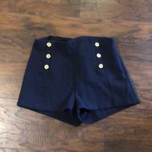 Navy shorts with gold buttons